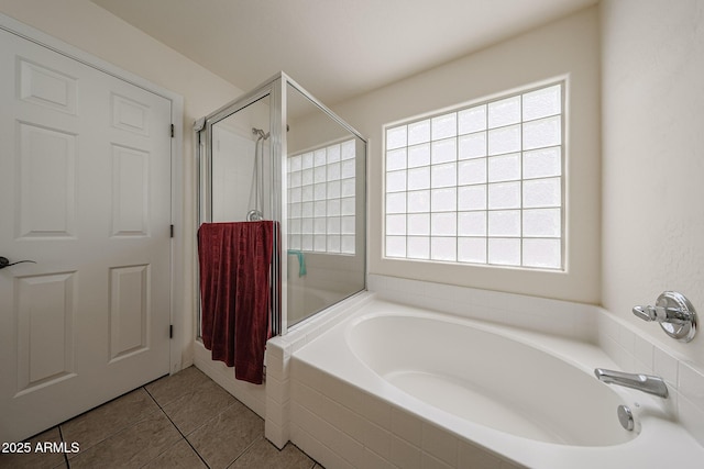 11563 W Jefferson St, Avondale, AZ 85323 - bathroom featuring a bath, plenty of natural light, a shower stall, and tile patterned floors