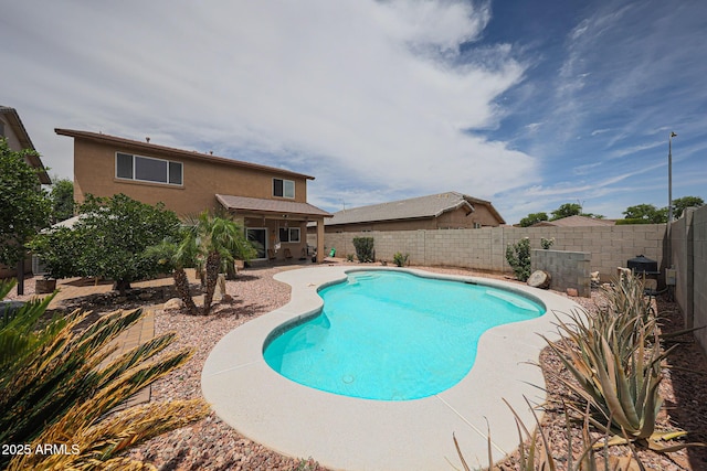11563 W Jefferson St, Avondale, AZ 85323 - view of swimming pool with a fenced backyard and a patio area