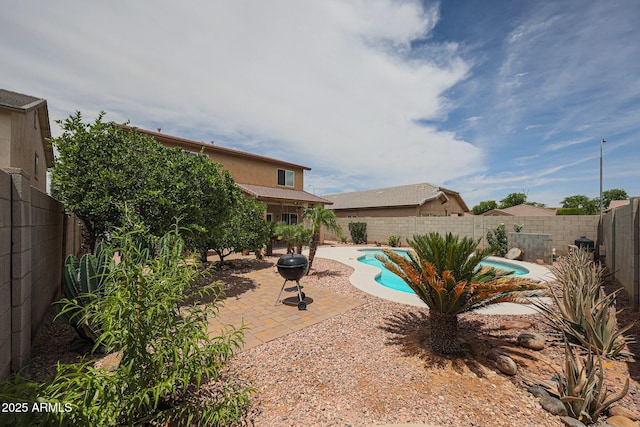 11563 W Jefferson St, Avondale, AZ 85323 - view of swimming pool with a patio and a fenced backyard