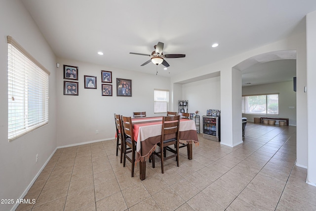 11563 W Jefferson St, Avondale, AZ 85323 - dining room featuring arched walkways, light tile patterned flooring, a ceiling fan, recessed lighting, and baseboards