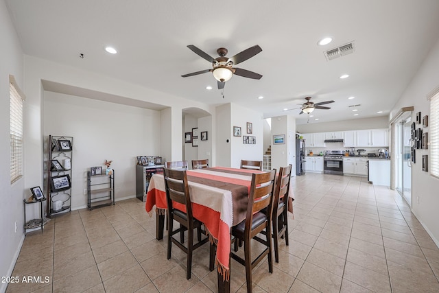11563 W Jefferson St, Avondale, AZ 85323 - dining space featuring ceiling fan, light tile patterned floors, recessed lighting, arched walkways, and healthy amount of natural light