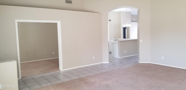 carpeted empty room with sink