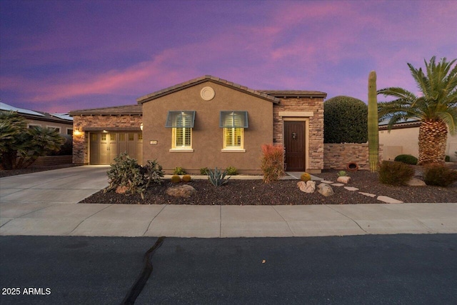 view of front of property with a garage