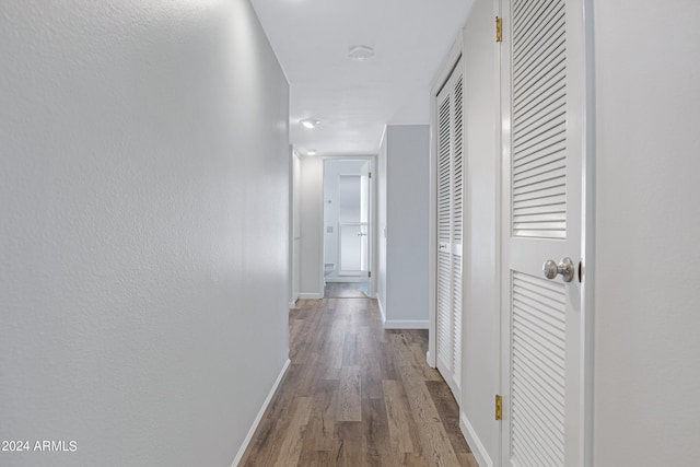 hallway featuring hardwood / wood-style flooring