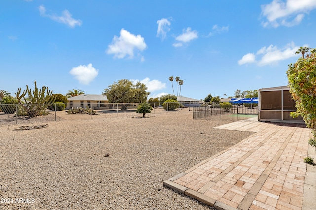 view of yard featuring a sunroom