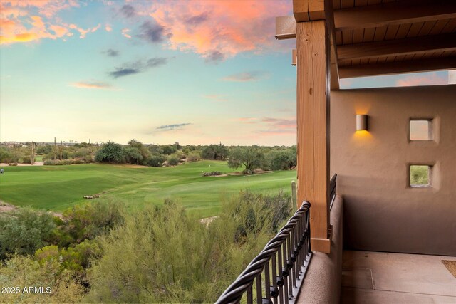 view of balcony at dusk