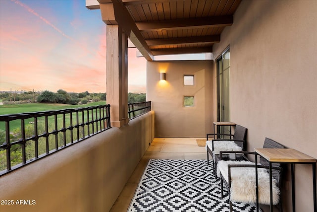 view of balcony at dusk