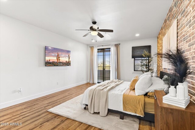 bedroom featuring ceiling fan and hardwood / wood-style flooring