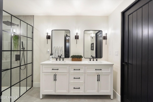 bathroom with tile patterned flooring, vanity, and walk in shower