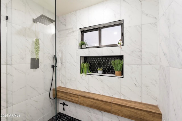 bathroom featuring a tile shower