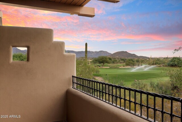 balcony at dusk with a mountain view