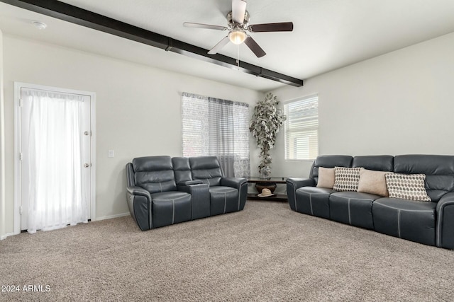 living room featuring beam ceiling, ceiling fan, and carpet