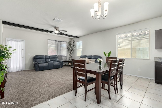 dining room with ceiling fan with notable chandelier and light carpet