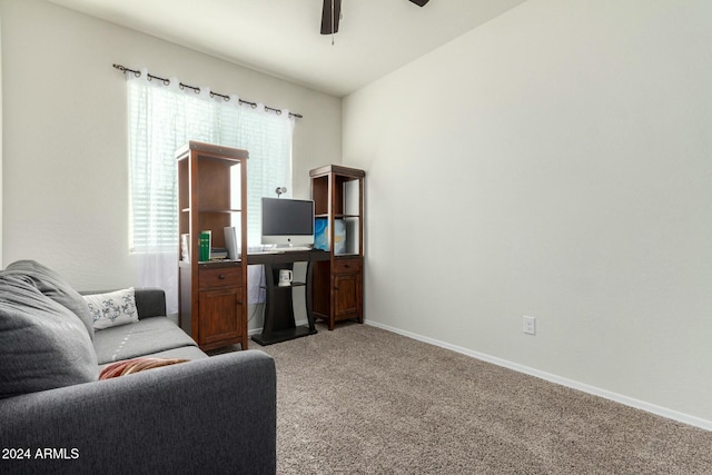 carpeted living room featuring ceiling fan