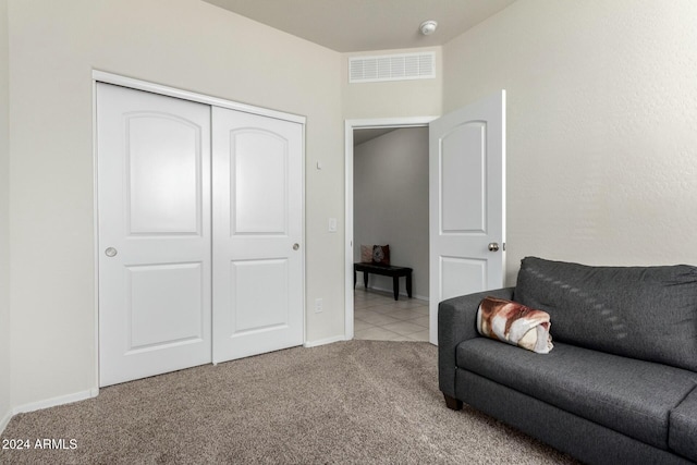 living area featuring light colored carpet