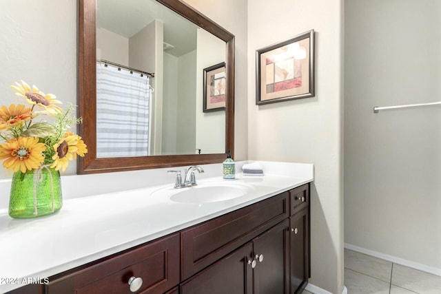 bathroom with tile patterned floors and vanity