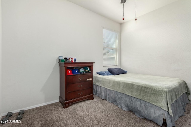 bedroom featuring ceiling fan and light carpet