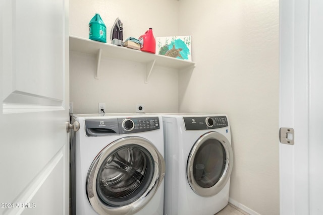 laundry room featuring washing machine and dryer