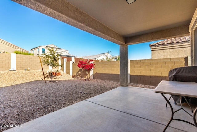 view of patio / terrace featuring a storage unit