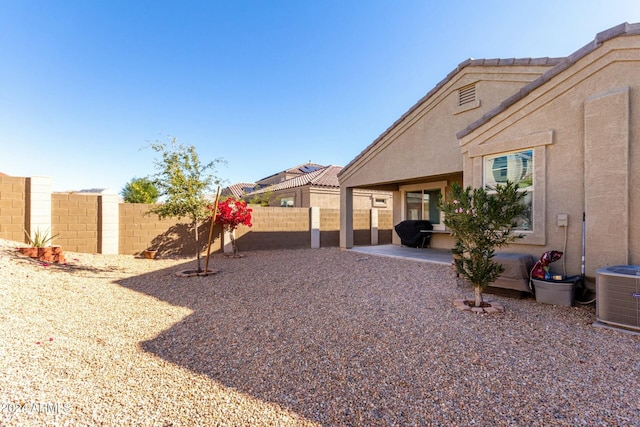 view of yard featuring a patio area and cooling unit