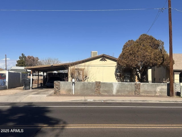 view of front of property featuring a carport