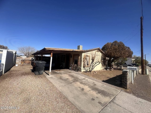 view of front of home featuring a carport