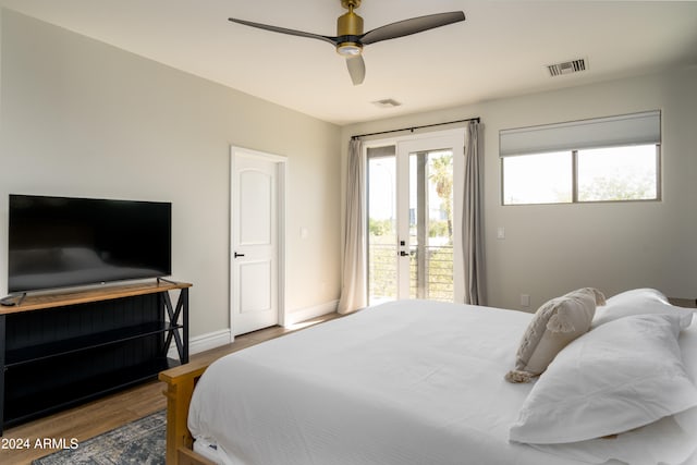 bedroom with french doors, ceiling fan, hardwood / wood-style floors, and access to exterior