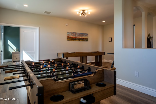 game room with dark hardwood / wood-style flooring