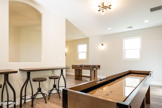 recreation room featuring light hardwood / wood-style flooring