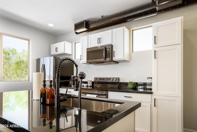 kitchen with sink and white cabinets