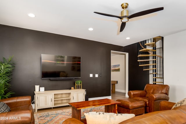 living room with light hardwood / wood-style floors and ceiling fan