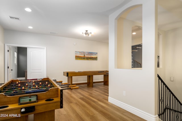 rec room with light wood-type flooring