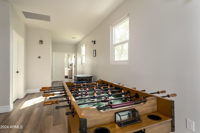 rec room with hardwood / wood-style floors