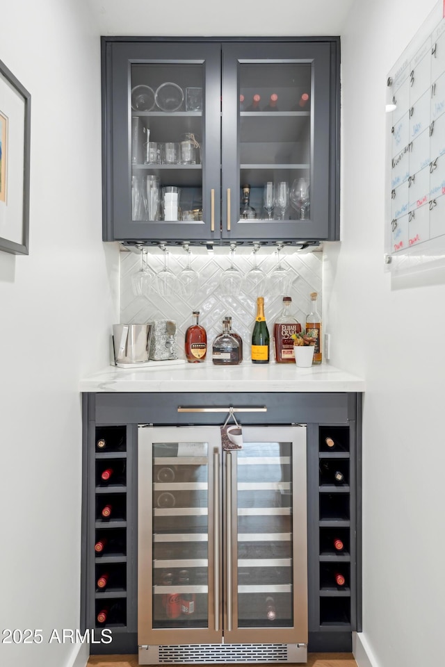 8001 N 3rd Pl, Phoenix, AZ 85020 - indoor dry bar featuring beverage cooler and decorative backsplash