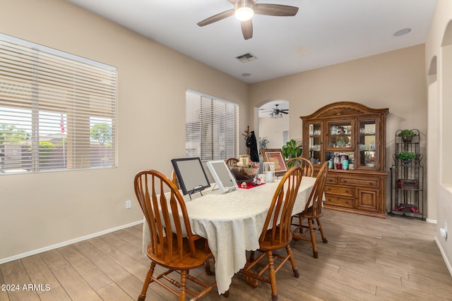 dining space featuring ceiling fan and light hardwood / wood-style floors