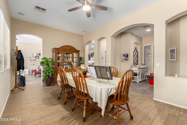 dining space featuring ceiling fan and light hardwood / wood-style flooring