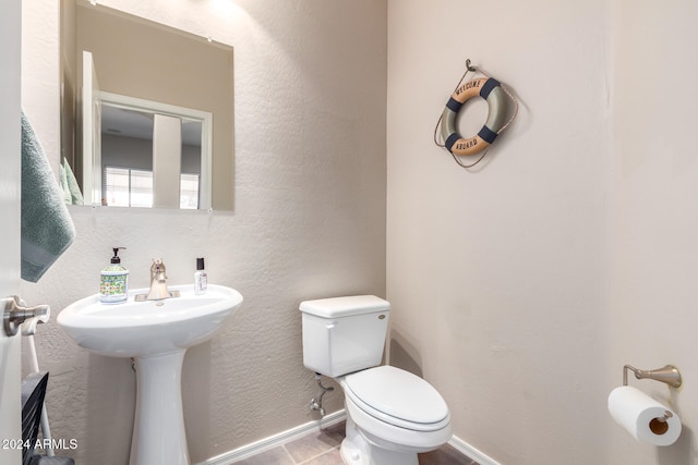 bathroom with sink and toilet