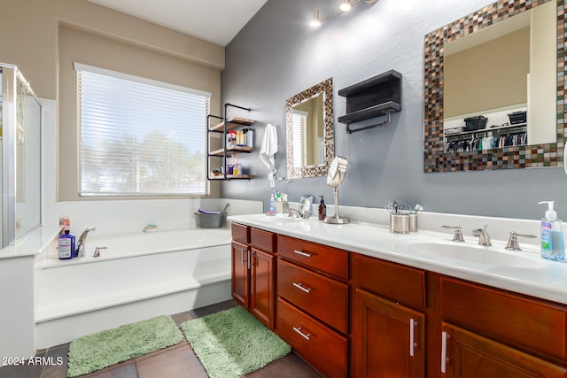 bathroom with vanity and a bathing tub