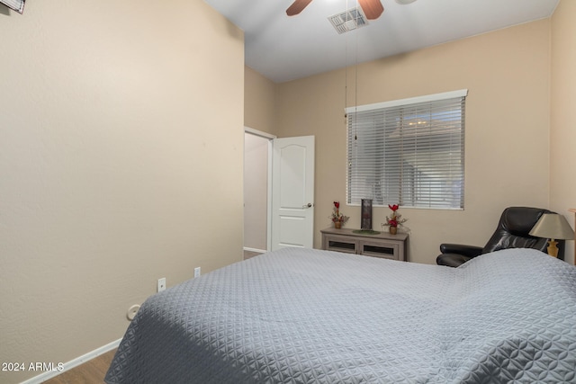 bedroom with hardwood / wood-style floors and ceiling fan