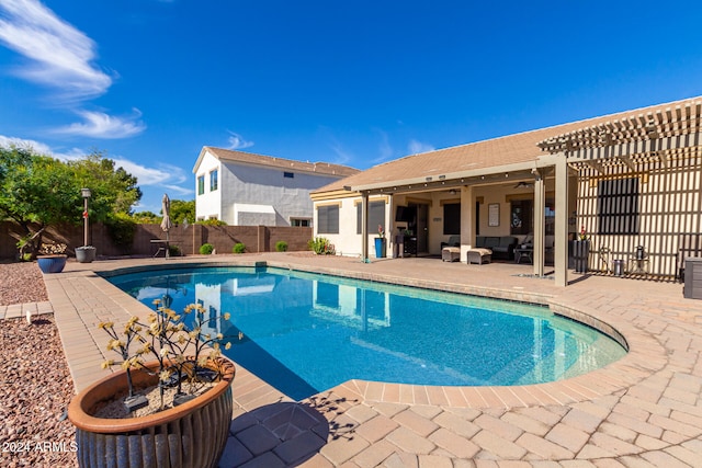 view of swimming pool featuring a patio and an outdoor hangout area