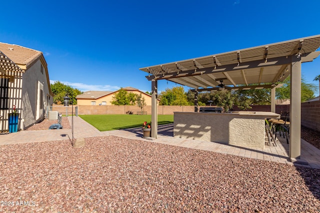 view of yard with a pergola, central AC, and a patio area