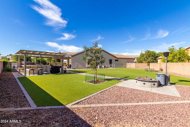 view of yard with a patio, a pergola, and an outdoor fire pit