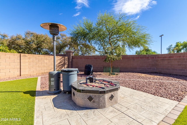 view of patio featuring a fire pit