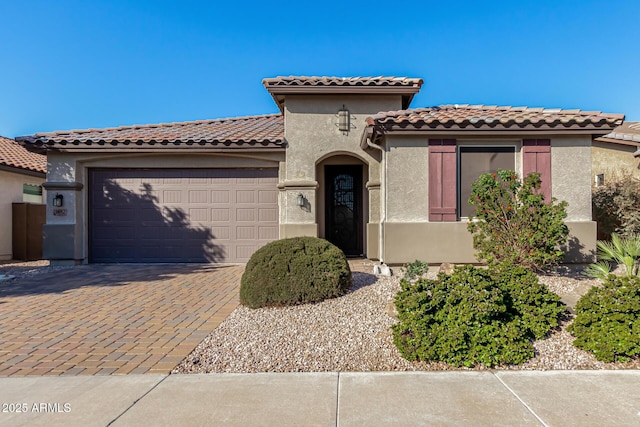 mediterranean / spanish-style house featuring a garage