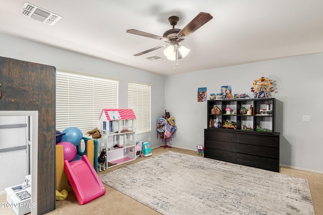 game room featuring ceiling fan and light colored carpet