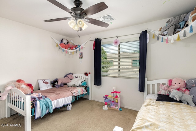 carpeted bedroom with ceiling fan