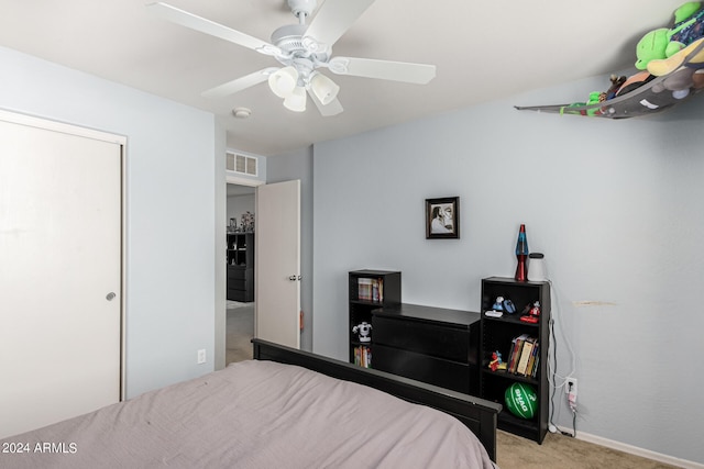 carpeted bedroom featuring ceiling fan