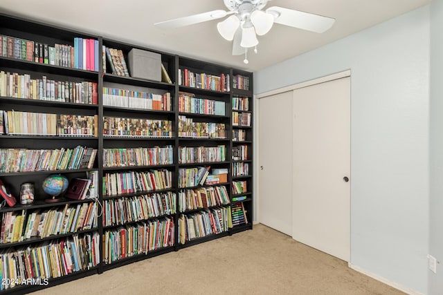 living area with light carpet