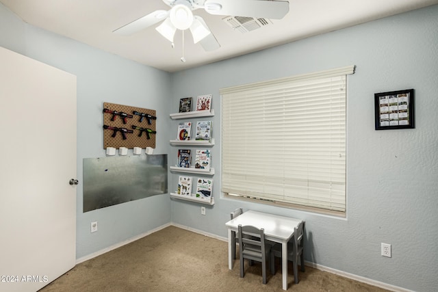 interior space with ceiling fan and light carpet