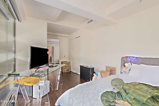 bedroom featuring a closet and dark hardwood / wood-style flooring